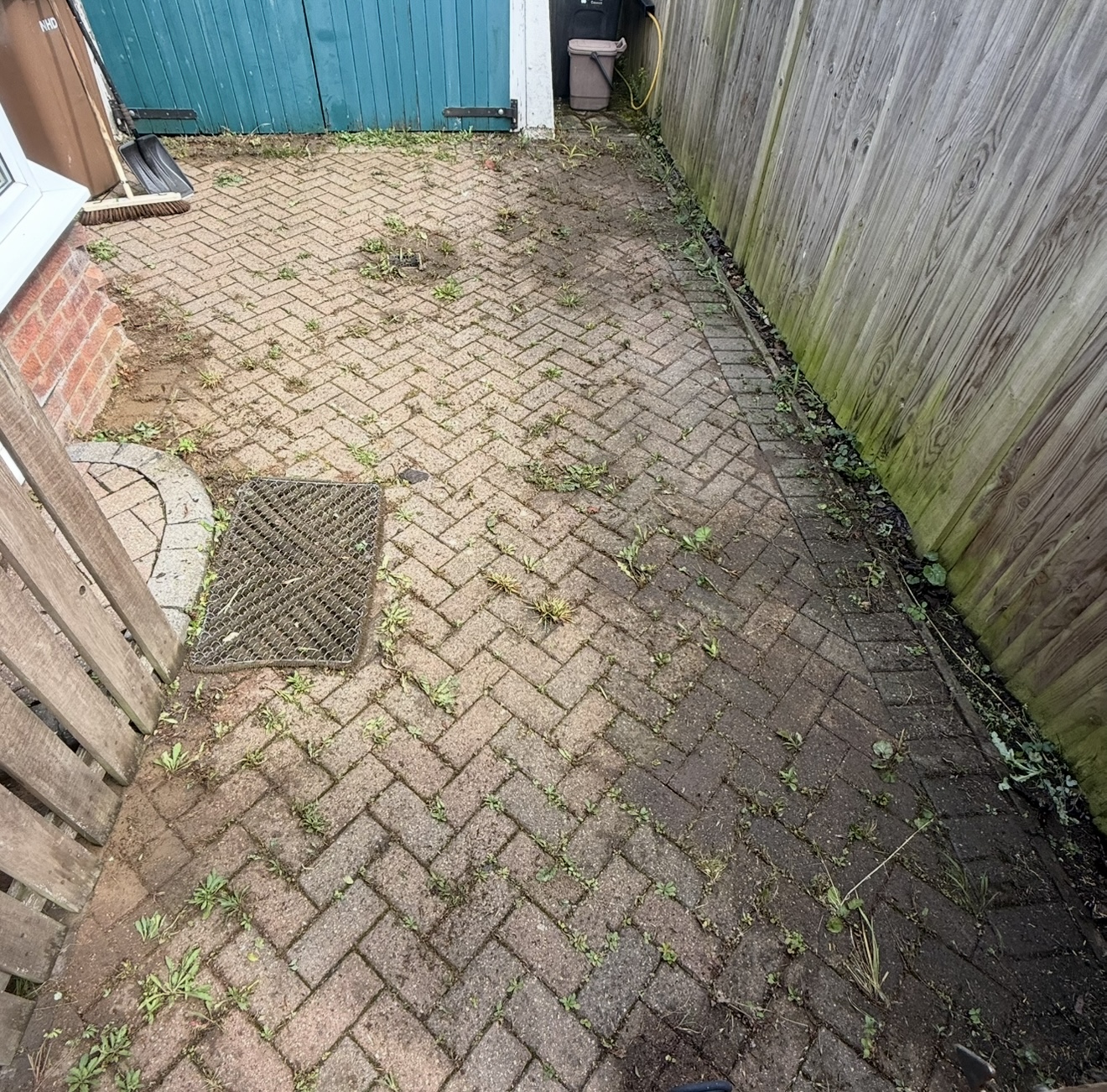 Grimy garden path before professional cleaning in Hitchin